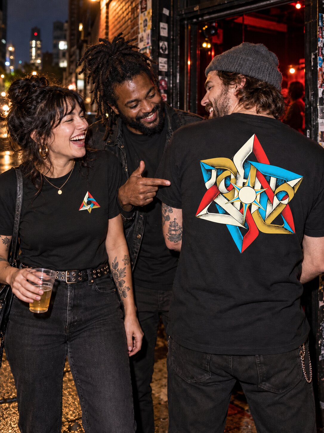 Conceptual campaign scene of friends wearing black Aperture shirts outside a small music venue